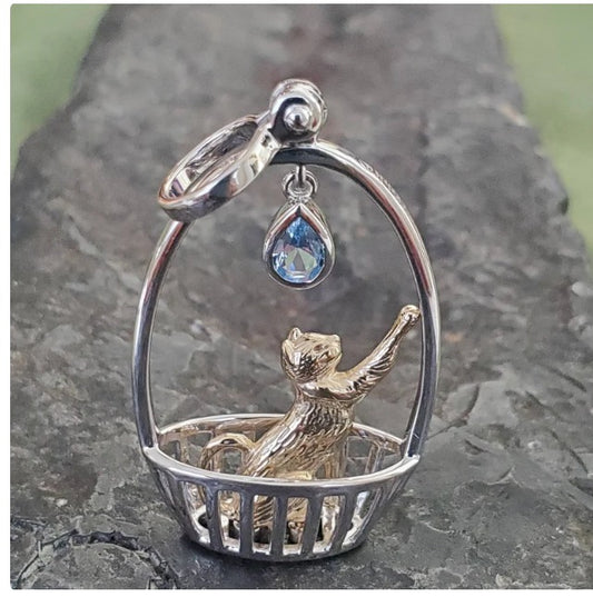 Beautiful cat pendant with blue topaz