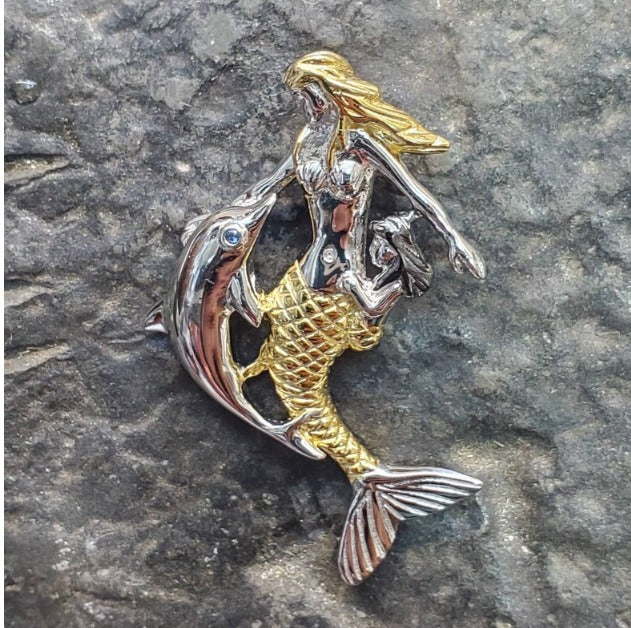 Mermaid with dolphin pendant