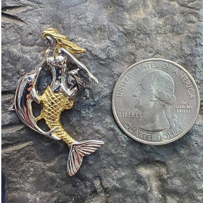 Mermaid with dolphin pendant