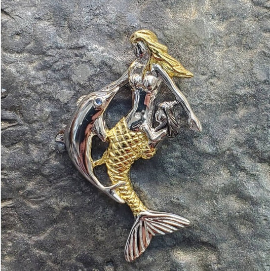 Mermaid with dolphin pendant