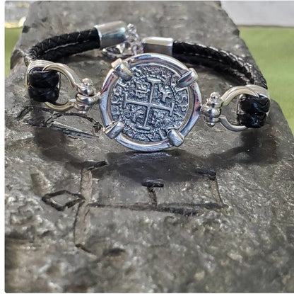 Atocha leather bracelet shipwreck treasure coin with shackles.