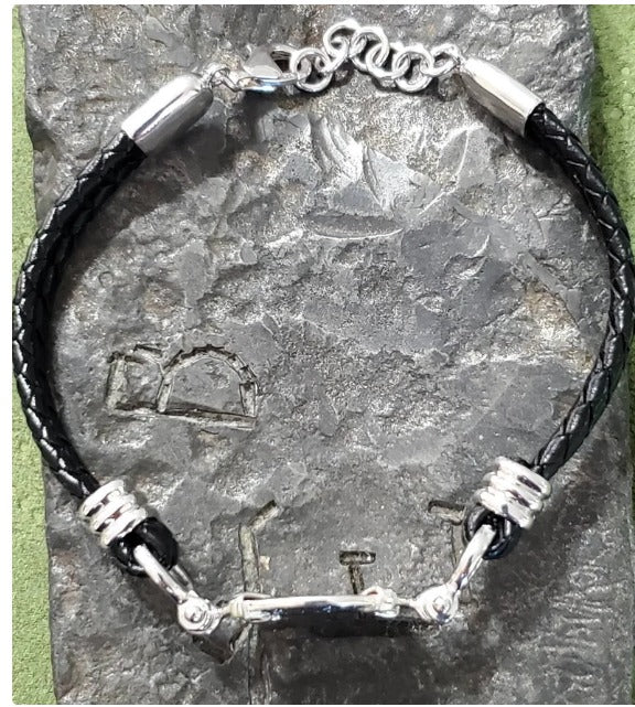 Atocha leather bracelet shipwreck treasure coin with shackles.